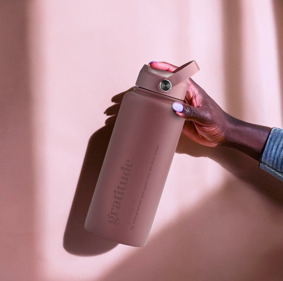 User demonstrating Selfdot’s bottle—a tool for modern mindful living.