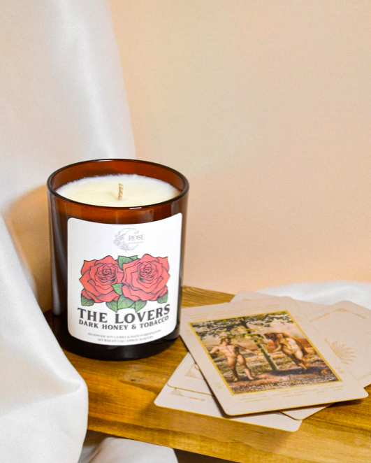 the lovers tatort card as candle on wooden deck